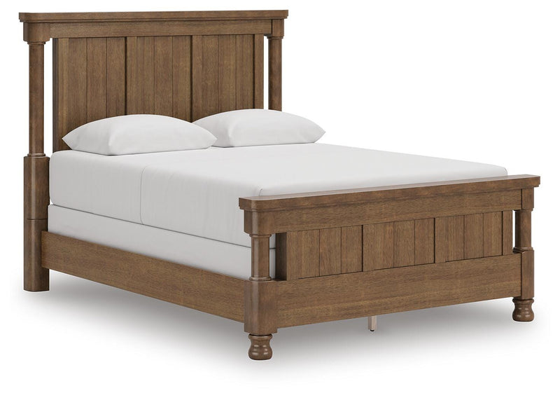 Ashley Furniture Rowlenstown Bed with a stylish wooden frame, shown in an angled view highlighting its elegant design.