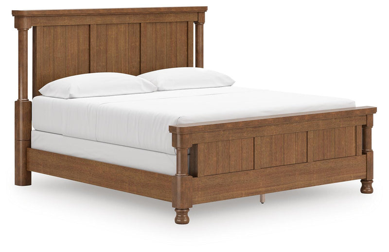 Ashley Furniture Chadworth Bed with a classic wooden frame, showcasing a sleek and sturdy design from a side and angle view.