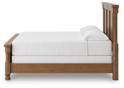 Ashley Furniture Rowlenstown bedroom set featuring a bed frame, nightstands, and matching dresser in a modern bedroom design.