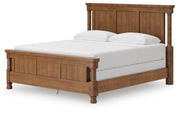 Ashley Furniture Rowlenstown bedroom set with a bed, nightstands, and dresser in a modern style, shown from an angled view.