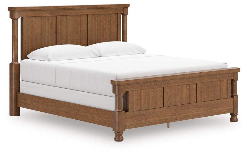 Ashley Furniture Rowlenstown bedroom set with a bed, nightstands, and dresser in a modern design, shown from an angled view.