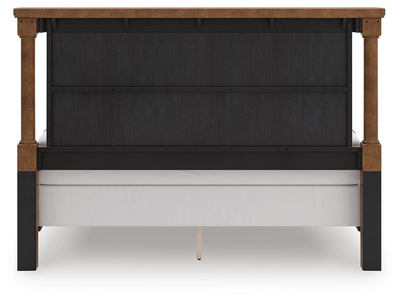 Ashley Furniture Rowlenstown bedroom set with bed frame, nightstands, and dresser shown from the back in a stylish bedroom scene