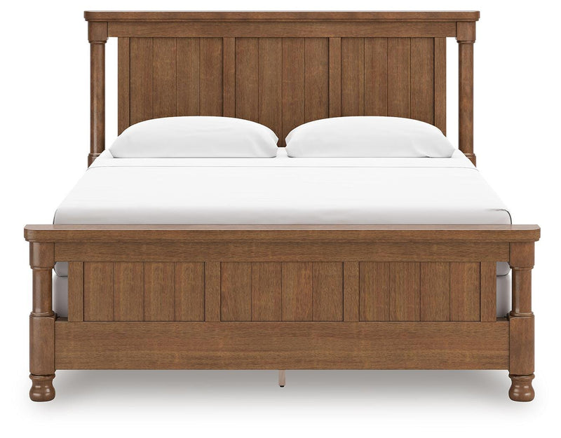 Ashley Furniture Chadworth Bed with a classic headboard and rich wood finish, showcasing a stylish bedroom furniture piece.