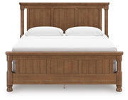 Ashley Furniture Rowlenstown bedroom set with a headboard, nightstand, and matching furniture in a cozy bedroom setting.