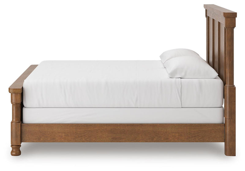 Ashley Furniture Rowlenstown bedroom set featuring a bed frame, nightstands, and matching decor in a modern bedroom setting.