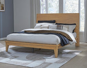 Ashley Furniture Sherbana Bed with upholstered headboard and wood frame, showcasing a modern bedroom design.