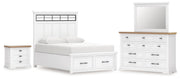 Ashley Furniture Ashbryn bedroom set with wood dresser, mirror, nightstands, and bed frame in a cozy bedroom scene.