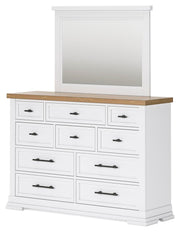Ashley Furniture Ashbryn bedroom set with a bed, nightstands, and dresser arranged in a modern bedroom scene.