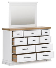 Ashley Furniture Ashbryn bedroom set with open view of bed, dresser, and nightstands in a modern bedroom setup.