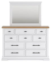 Ashley Furniture Ashbryn bedroom set with a bed, nightstands, and dresser, featuring a modern design and neutral finish.