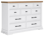 Ashley Furniture Ashbryn Dresser with sleek wood finish and multiple drawers, shown from an angled side view.