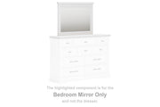 Ashley Furniture Ashbryn bedroom mirror with a sleek wooden frame, reflecting a modern bedroom decor.