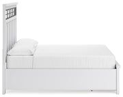 Ashley Furniture Ashbryn bedroom set with a bed, nightstands, and dresser in a modern bedroom layout.