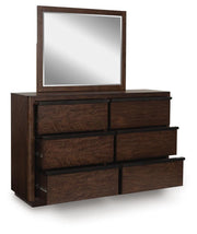 Ashley Furniture Dilenno bedroom set with a bed, nightstands, and dresser in a modern, stylish bedroom arrangement.