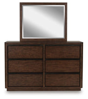 Ashley Furniture Dilenno bedroom set featuring a headboard with a sleek, closed design in a modern bedroom setting.