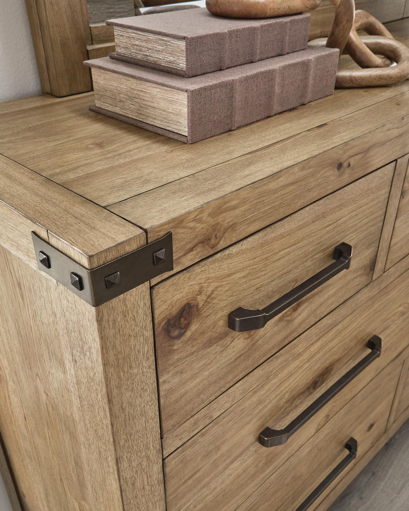 Ashley Furniture Ridgester dresser with multiple drawers and a dark wood finish, detailed close-up of the dresser's hardware and surface.
