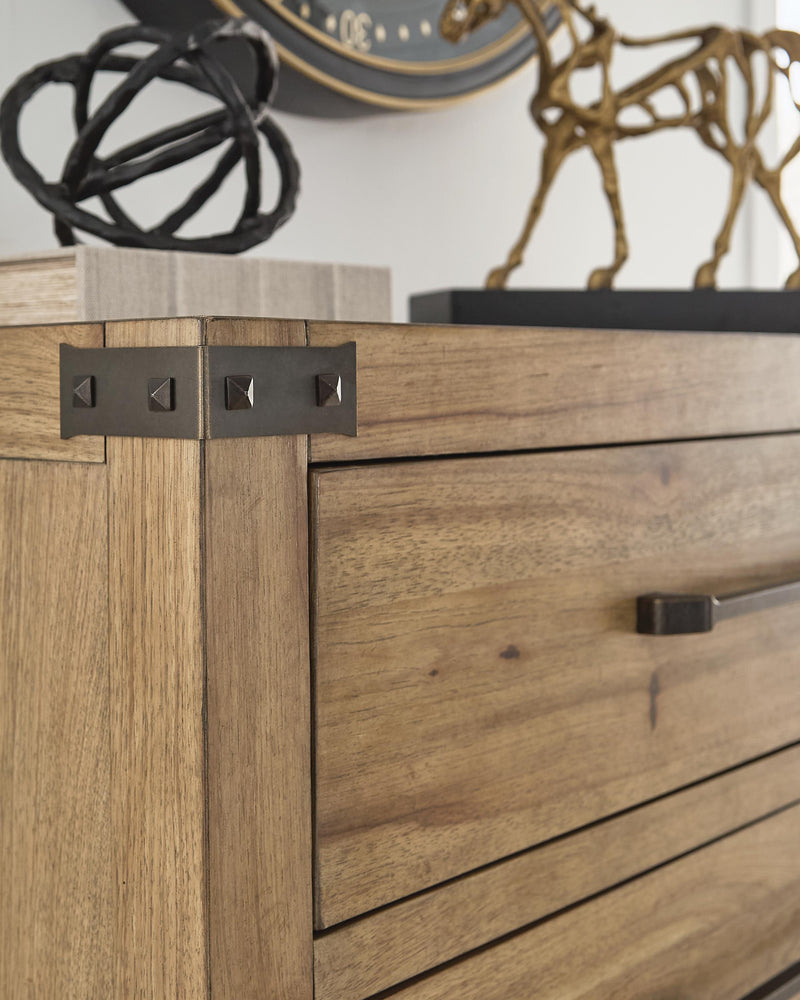 Ashley Furniture Ridgester chest of drawers with a dark wood finish and multiple drawers for bedroom storage.