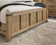 Ashley Furniture Ridgester Bed with detailed wood finish and modern design, showcasing the headboard and frame.