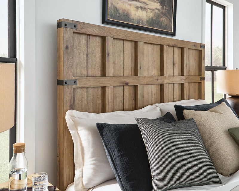 Ashley Furniture Ridgester Bed with detailed headboard in warm wood finish, showcasing classic bedroom design.
