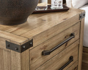 Close-up of Ashley Furniture Ridgester nightstand handle and bracket detail showing the dark wood finish and modern design.
