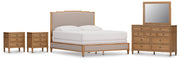 Ashley Furniture Sharlance bedroom set featuring a bed frame, matching nightstands, and a dresser in a modern bedroom design.