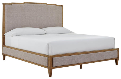 Ashley Furniture Sharlance King Upholstered Bed with a plush fabric headboard and elegant design, shown from an angled side view.