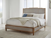 Ashley Furniture Sharlance bedroom set with a modern bed frame, matching nightstands, and a stylish dresser in a contemporary bedroom.