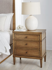 Ashley Furniture Sharlance bedroom set with a bed, nightstands, and dresser in a cozy, modern bedroom scene
