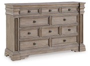 Ashley Furniture Blairhurst dresser with multiple drawers and polished wood finish, shown from an angled closed view.