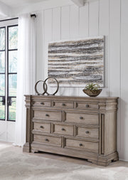 Ashley Furniture Blairhurst dresser with dark wood finish and multiple drawers, featuring modern hardware for bedroom storage.