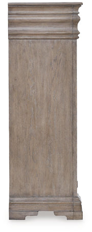 Ashley Furniture Blairhurst Chest of Drawers featuring a classic wooden chest with multiple drawers and a polished finish.
