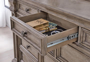 Close-up of the Ashley Furniture Blairhurst Dresser showcasing its wood finish, detailed drawer handles, and elegant design.