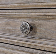 Close-up of Ashley Furniture Blairhurst Chest of Drawers with detailed wooden drawer knobs and rich finish.