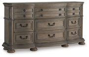 Ashley Furniture Ardenfield Dresser with closed drawers, showcasing a sleek wood finish and modern design from an angled side view.