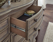 Ashley Furniture Ardenfield Dresser featuring felt-lined drawer glides and a sleek wood finish.