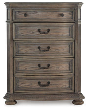 Ashley Furniture Ardenfield chest of drawers with a sleek wood finish and multiple storage drawers, head-on view.