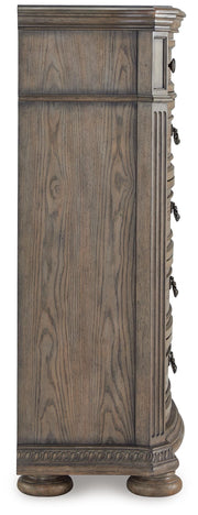 Ashley Furniture Ardenfield chest of drawers with a sleek wooden finish and multiple spacious drawers for storage.