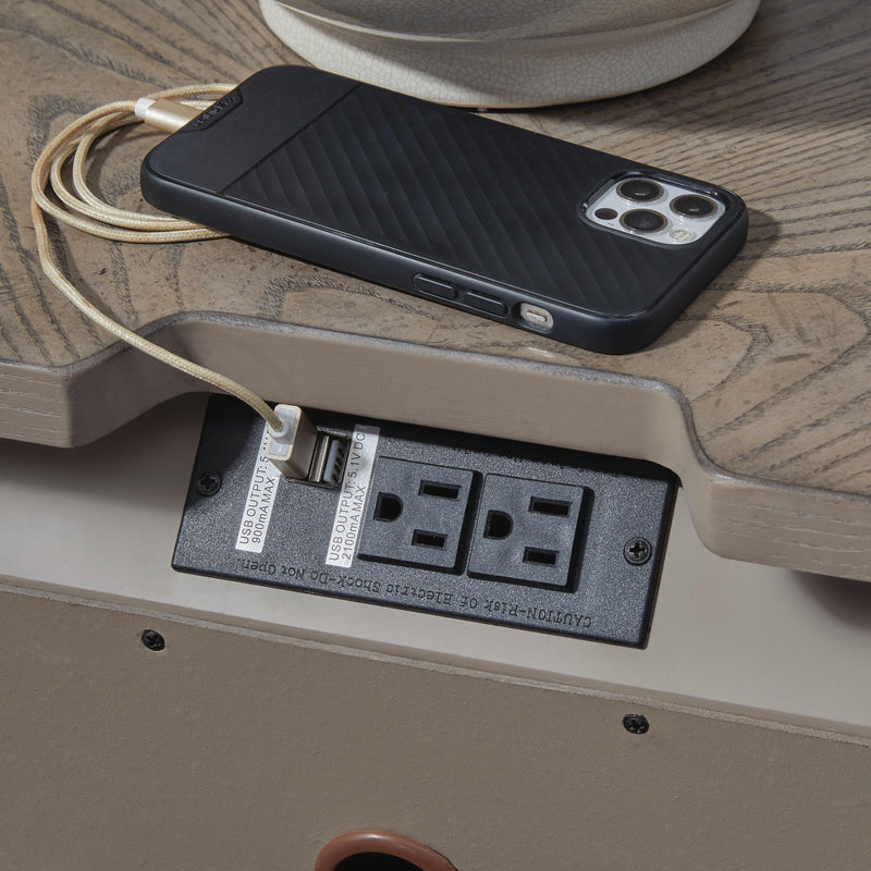 Ashley Furniture Ardenfield nightstand with USB ports, featuring a dark wood finish and modern design, shown with drawer handles.