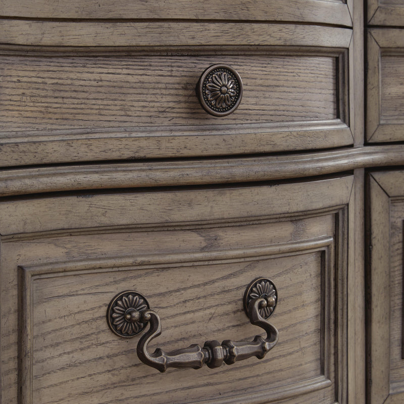 Ashley Furniture Ardenfield chest of drawers showing hardware detail on a classic wooden storage chest.