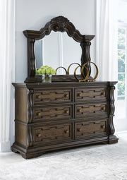 Ashley Furniture Maylee Bedroom Set featuring a bed, matching nightstands, and dresser in a modern bedroom style.