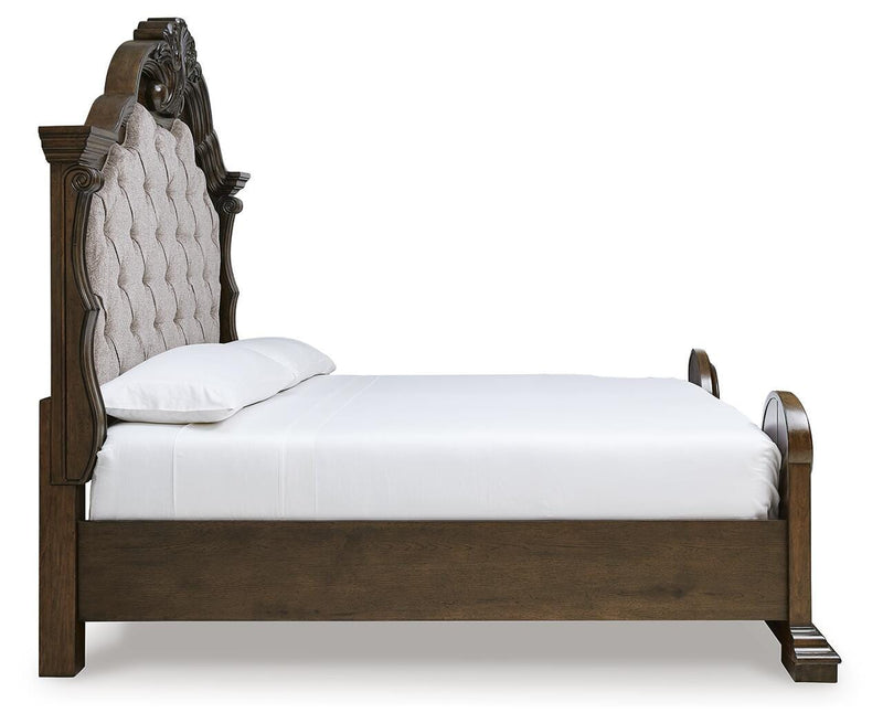 Ashley Furniture Maylee bedroom set with a modern bed frame, nightstands, and matching dresser in a stylish bedroom setup.