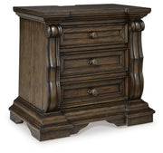 Ashley Furniture Maylee bedroom set featuring a neatly made bed, matching nightstands, and stylish bedroom decor in a well-lit room.