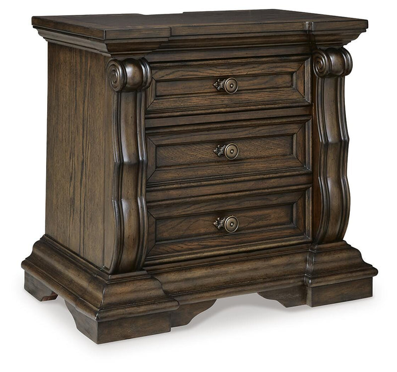 Ashley Furniture Maylee bedroom set featuring a neatly made bed, matching nightstands, and stylish bedroom decor in a well-lit room.