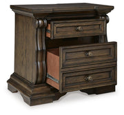 Ashley Furniture Maylee bedroom set with a view of the bed frame, nightstands, and coordinated bedroom furniture.
