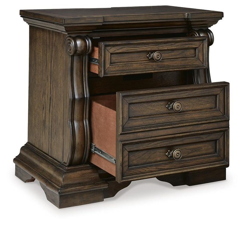 Ashley Furniture Maylee bedroom set with a view of the bed frame, nightstands, and coordinated bedroom furniture.