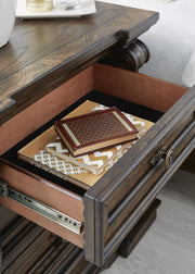 Ashley Furniture Maylee bedroom set featuring a dark wood finish with a bed, dresser, and matching nightstands.