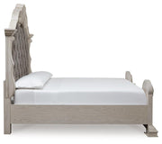 Ashley Furniture Bruchandi bedroom set featuring a bed with a dark wood finish and matching nightstands, styled in a cozy bedroom scene.