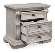 Ashley Furniture Bruchandi bedroom set with a bed, dresser, and nightstands, shown from an angled open view.