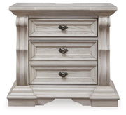 Ashley Furniture Bruchandi bedroom set featuring a chic headboard, stylish bedding, and coordinated bedroom furniture in a modern design.