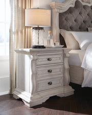 Ashley Furniture Bruchandi bedroom set featuring a bed frame, matching nightstands, and dresser with modern design.